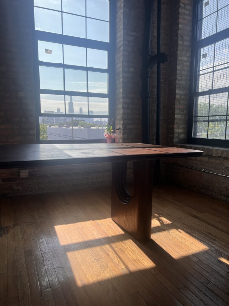 A view of the Chicago Skyline and Willis Tower from a conference table