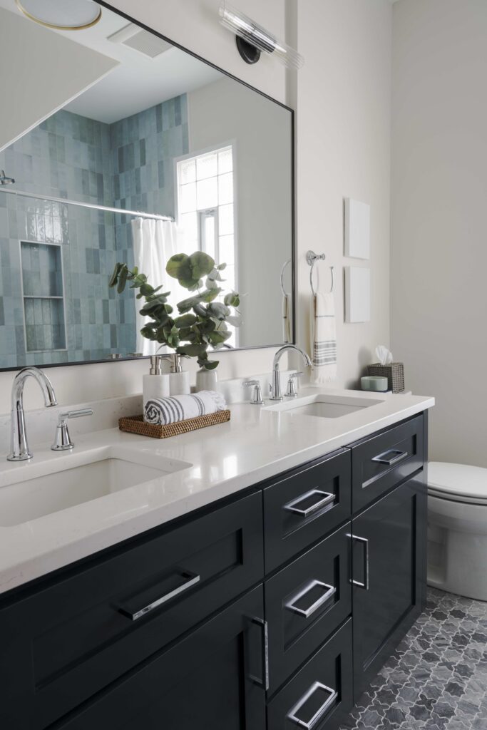 full-service-interior-designer-60614-chicago-home-reveal-bathroom-renovation-soothing-blue-and-gray-tones-deep-blue-vanity-patterned-tile-floor-thoughtful-kitchen-remodel