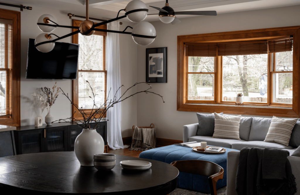 kp-home-north-woods-wi-home-reveal-family-room-transformation-historic-home-with-character-sectional-sofa-blue-ottoman-cozy-touches-performance-fabric-sophisticated-renovation