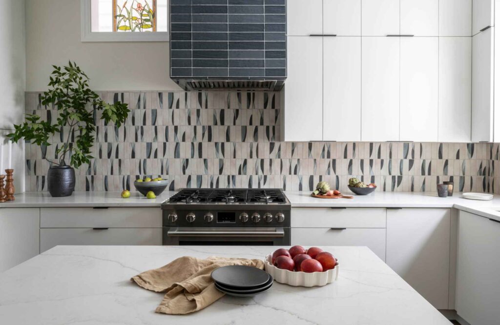 kp-home-lake-view-il-unexpected-surprises-during-home-projects-kitchen-renovation-creative-patterned-backsplash-tile-white-cabinets-tiled-range-hood-edgy-interior-design