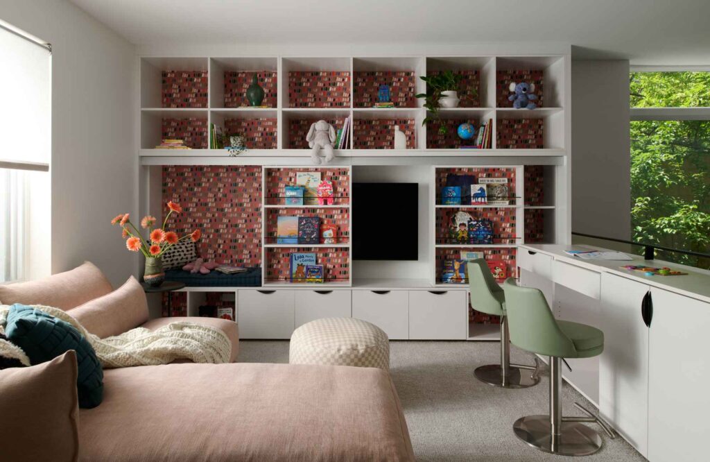 full-service-interior-designer-60614-discovering-your-personal-design-style-family-room-playful-patterns-sliding-bookshelf-hidden-tv-colorful-accents-authentic-design