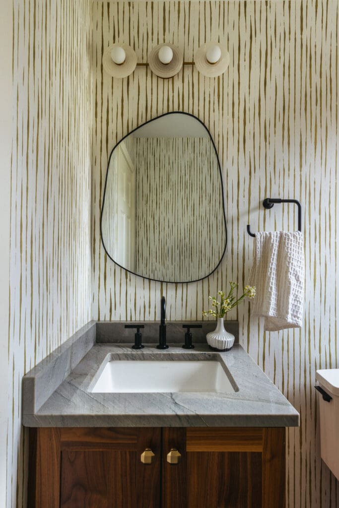 full-service-interior-designer-54843-timeless-family-home-renovation-playful-powder-room-nature-inspired-wallpaper-organic-curved-mirror-mixed-metals-authentic