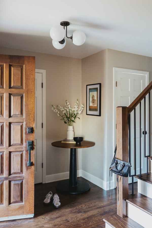 kp-home-lake-view-il-timeless-family-home-renovation-classic-entryway-modern-3-bulb-light-fixture-color-edgy-interior-design