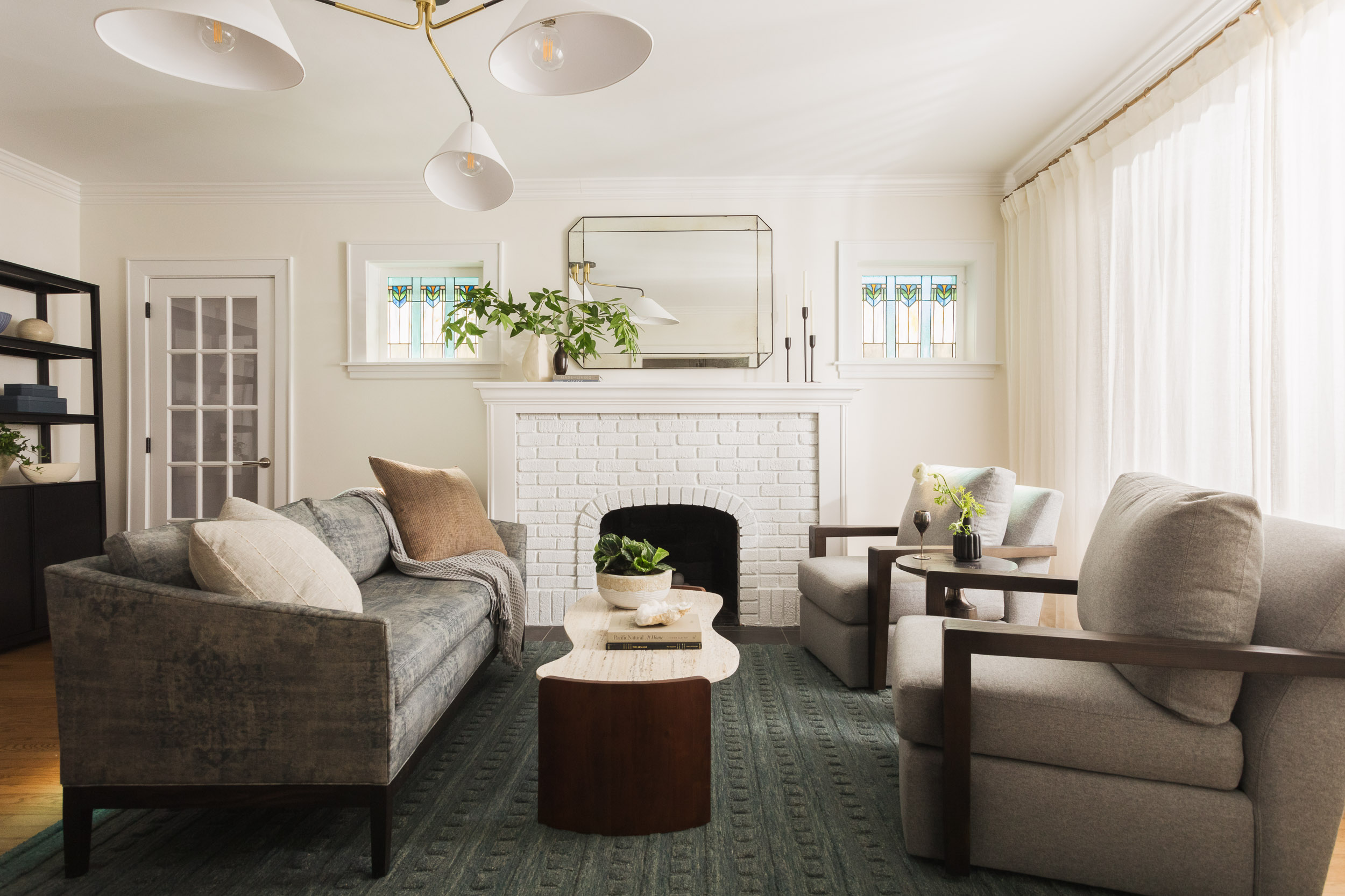 full-service-interior-design-60091-guidance-through-design-process-formal-living-room-rich-deep-colors-curved-coffee-table-comfortable-furnishings-thoughtful