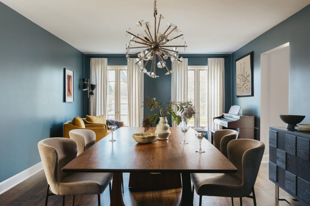 full-service-interior-design-lincoln-park-il-what-timeless-design-means-dining-room-with-teal-walls-upholstered-chairs-modern-light-fixture-authentic-design