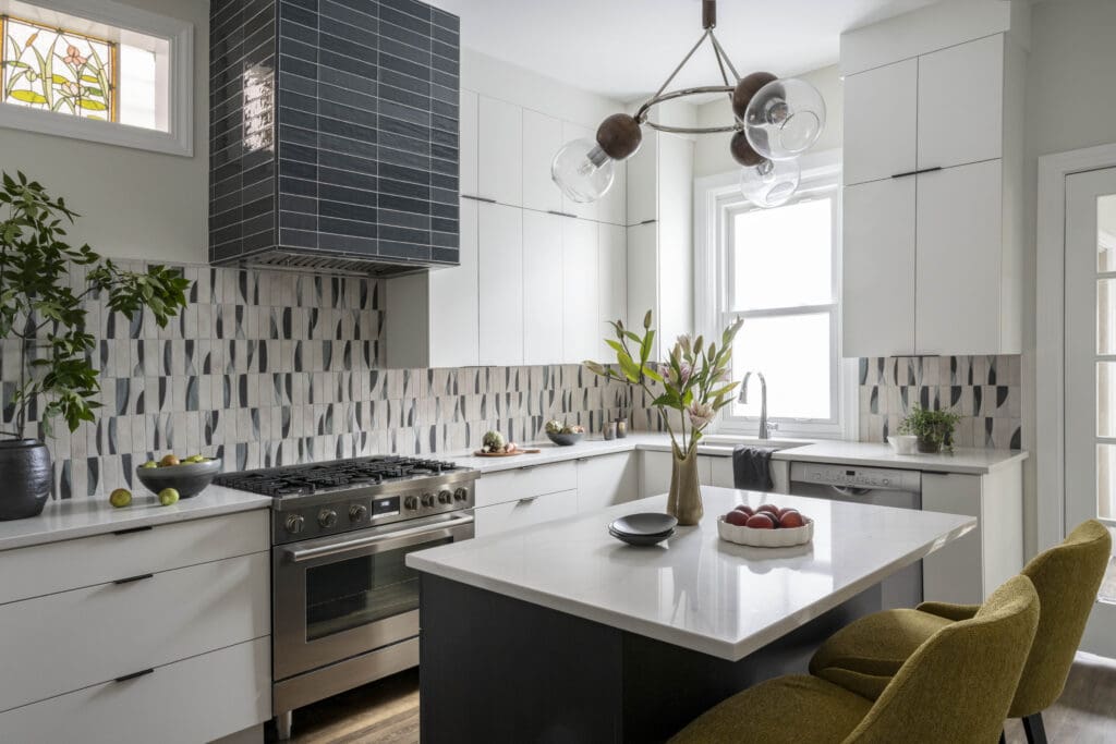 kp-home-chicago-il-what-timeless-design-means-contemporary-kitchen-blue-and-white-patterned-backsplash-tile-island-with-seating-edgy-kitchen-remodel