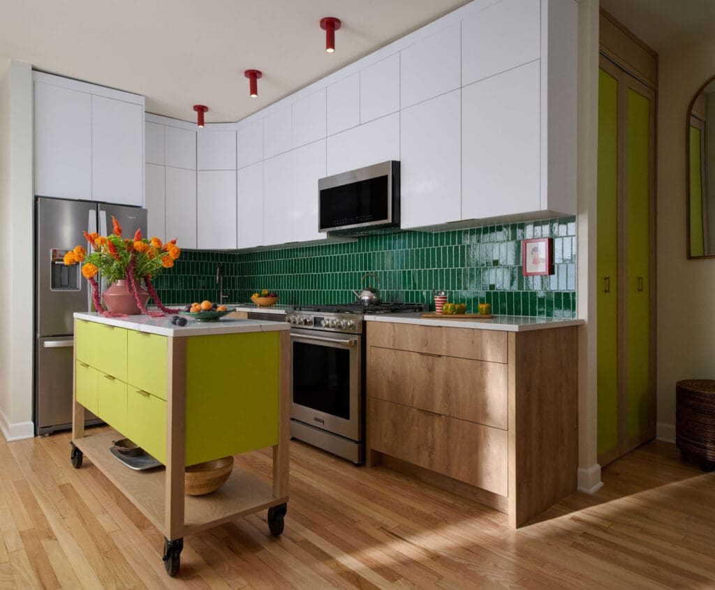 kp-home-lincoln-park-il-what-timeless-design-means-bold-colorful-kitchen-deep-green-backsplash-island-on-casters-modern-interior-design
