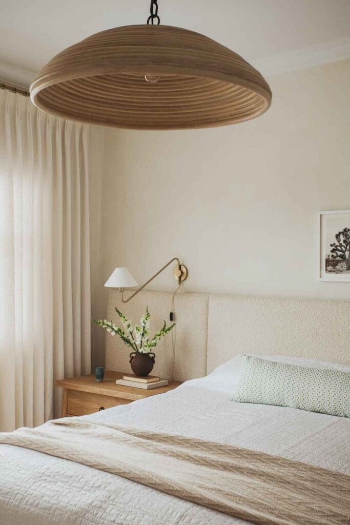 full-service-interior-designer-lake-view-il-logan-square-home-tour-primary-bedroom-soft-colors-woven-natural-light-fixture-extended-upholstered-headboard-sconce-personal