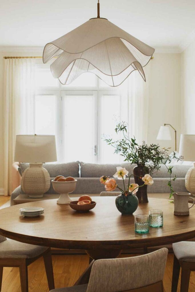 kp-home-60614-logan-square-home-tour-round-wood-dining-table-soft-white-undulating-light-fixture-texture-soft-colors-authentic-interior-design