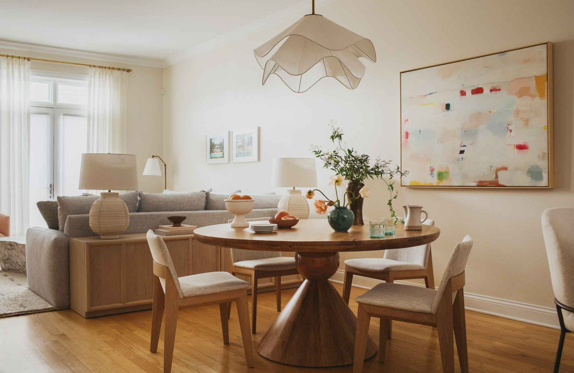 kp-home-chicago-il-logan-square-home-tour-open-floor-plan-dining-and-living-room-soft-pastel-colors-round-dining-table-custom-sectional-modern-kitchen-remodel